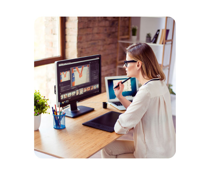 creative WordPress designer looking at design files on her desktop